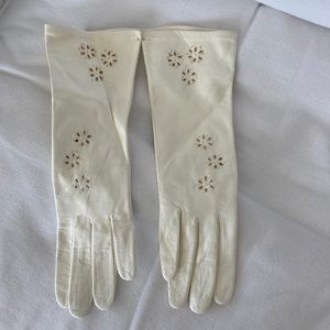 Cream colored decorative, leather gloves. Never worn.